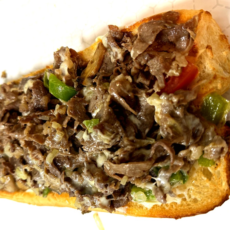 Ribeye Cheesesteak — loaded with Cooper Sharp